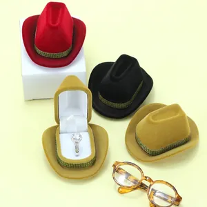 Miniature velvet cowboy hat jewelry box displaying a ring with various color options