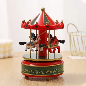Detailed view of a classic red and green carousel music box with rotating horses