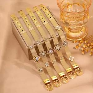 Detailed view of five gold-plated titanium mesh bracelets with elegant clover shaped charms.