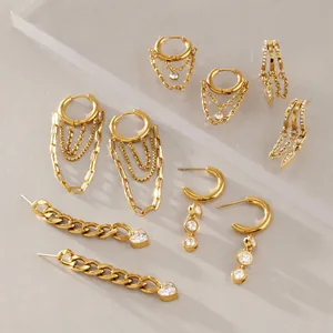 Detail view of gold-plated stainless steel earrings with zircon and tassels