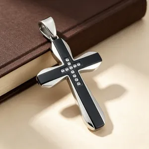 Close-up of double-layer stainless steel cross pendant with inlaid crystals.