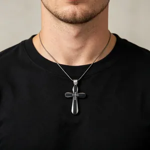Detail shot of a men's two-tone hip-hop cross pendant necklace featuring sparkling rhinestones