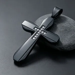 Close-up of black stainless steel cross pendant with inlaid clear zirconia stones
