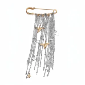Elegant golden safety pin brooch with silver tassel chains featuring star and dove charms