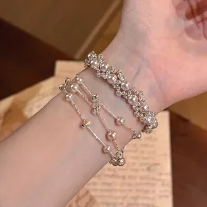 Exquisite French retro style layered pearl and rhinestone bracelet set for an elegant look