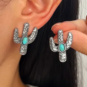 Nahaufnahme von Vintage-Silber-Kaktus-Ohrringen mit Türkissteinen im Western-Stil