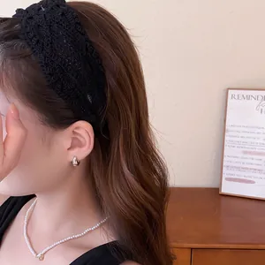 Detailed view of an elegant black French vintage lace hollow wide headband for women