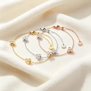 Elegante Kleeblatt-Armbänder in Gold, Silber und Roségold mit funkelnden Steinen