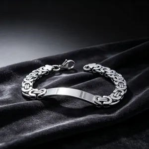 High-quality close-up of silver stainless steel Byzantine chain bracelet on black velvet.