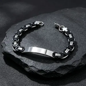 Detailed close-up of men's Byzantine chain bracelet with polishable steel plate