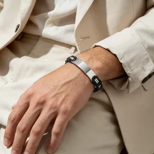 Close-up of men's Byzantine chain titanium steel bracelet with a smooth curved plate.