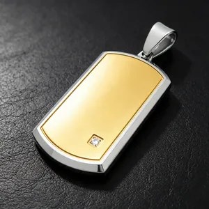 Close-up of two-tone gold and silver dog tag pendant with a small diamond accent