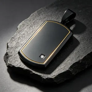 Detail view of a black titanium military tag pendant with gold border and small diamond