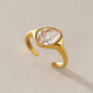 Close-up of a gold-plated stainless steel ring with a pear-shaped zircon gemstone.