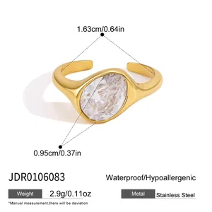 Detail view of gold-plated stainless steel ring featuring an oval-cut clear cubic zirconia.