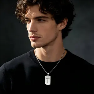 Detailed view of a silver titanium steel dog tag necklace with a diamond-set cross