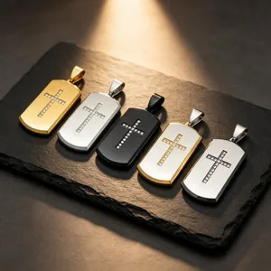 Detailed view of cross dog tag pendants in gold, silver and black finishes.