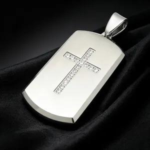 Close-up showing the diamond-encrusted cross detail on the polished dog tag pendant.
