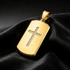 Close-up of a gold dog tag pendant featuring a rhinestone cross on black silk