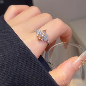 Detailed view of an elegant marquise-cut champagne zircon open-adjustable ring worn on a finger