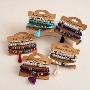 Detail view of 4-piece bohemian beaded bracelet sets with rhinestone hamsa charms.
