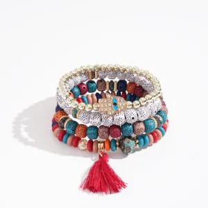 Bohemian 4-piece acrylic beaded bracelet set with Hamsa hand charm and red tassel