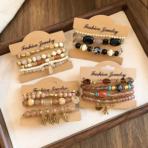Close-up of bohemian acrylic beaded bracelet sets presented on kraft display cards