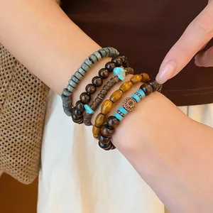 Close-up of bohemian multilayer beaded bracelet set with vintage ethnic style wood beads.