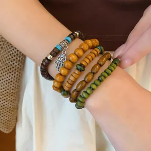 Bohemian multi-layer wood beaded bracelet set with ethnic Hamsa hand charm for women