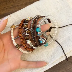 Detailed close-up showing Bohemian multilayered beaded bracelet set with ethnic turquoise charms