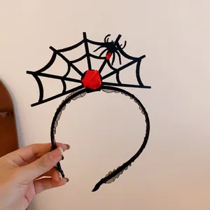 Halloween party headband with detailed spider web, red satin rose, and a tiny spider