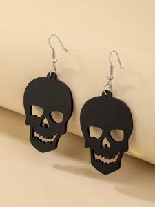 Detailed view of Gothic matte black skull dangling earrings for Halloween party
