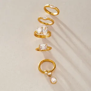 High-quality close-up of elegant gold titanium steel rings with clear zircon stone details
