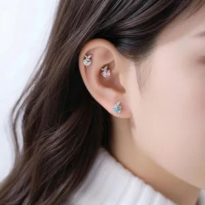 Elegant apple-shaped piercing stud earrings with sparkling diamonds and titanium bars