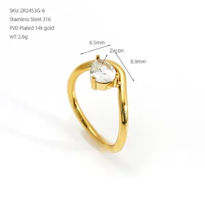 Detail view of a gold irregular ring with a pear-shaped zircon and dimensions.