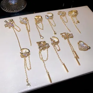 Elegant gold tassel ear cuffs with zircon flowers and stars for non-pierced ears.