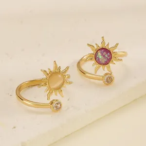 Close-up of vintage sun adjustable rings with iridescent and cat-eye stones