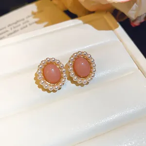 Elegant oval pink resin stud earrings with white pearl halo design fashion jewelry