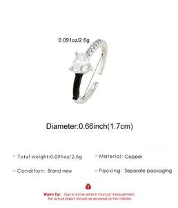 Close-up of heart zircon open ring with copper material and size specifications
