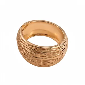 Elegant wide gold-tone cuff bangle featuring a unique hammered wrinkled texture design