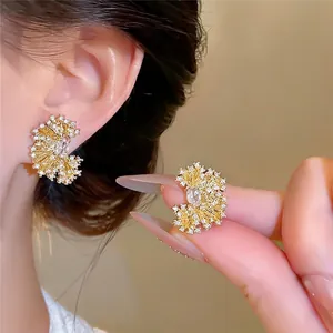 Luxury 18k gold plated fan-shaped earrings featuring oval cubic zirconia and pleated textures