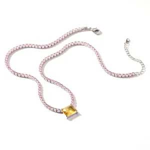 Macro view of a luxurious pink tennis necklace with a radiant yellow zircon pendant