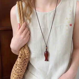 Vintage wooden fish pendant necklace with adjustable brown cord for women