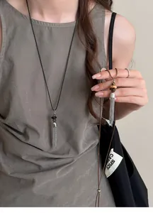 Detailed view of New Chinese style silver tassel necklace with beads on a model