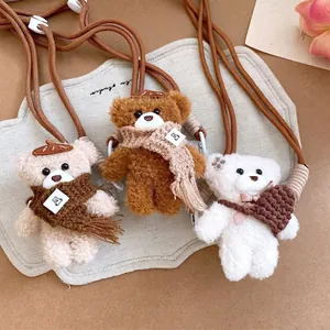 Cozy plush bear phone charms with scarves and brown braided lanyards in three colors