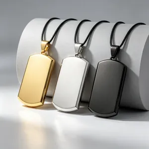 Macro view of three blank titanium steel dog tag pendants in gold, silver and black colors
