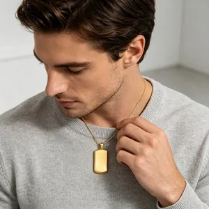 Men's gold blank dog tag pendant necklace shown on a male model for scale