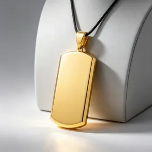 Polished gold blank dog tag pendant on black cord detail showing smooth titanium steel