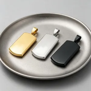 Detail view of three engravable blank stainless steel dog tag pendants in gold, silver, black.