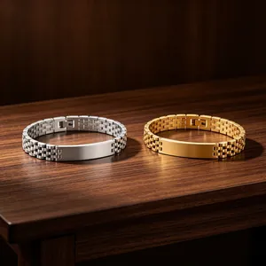 Detailed view of silver and gold watch-band style bracelets with engravable blank plates